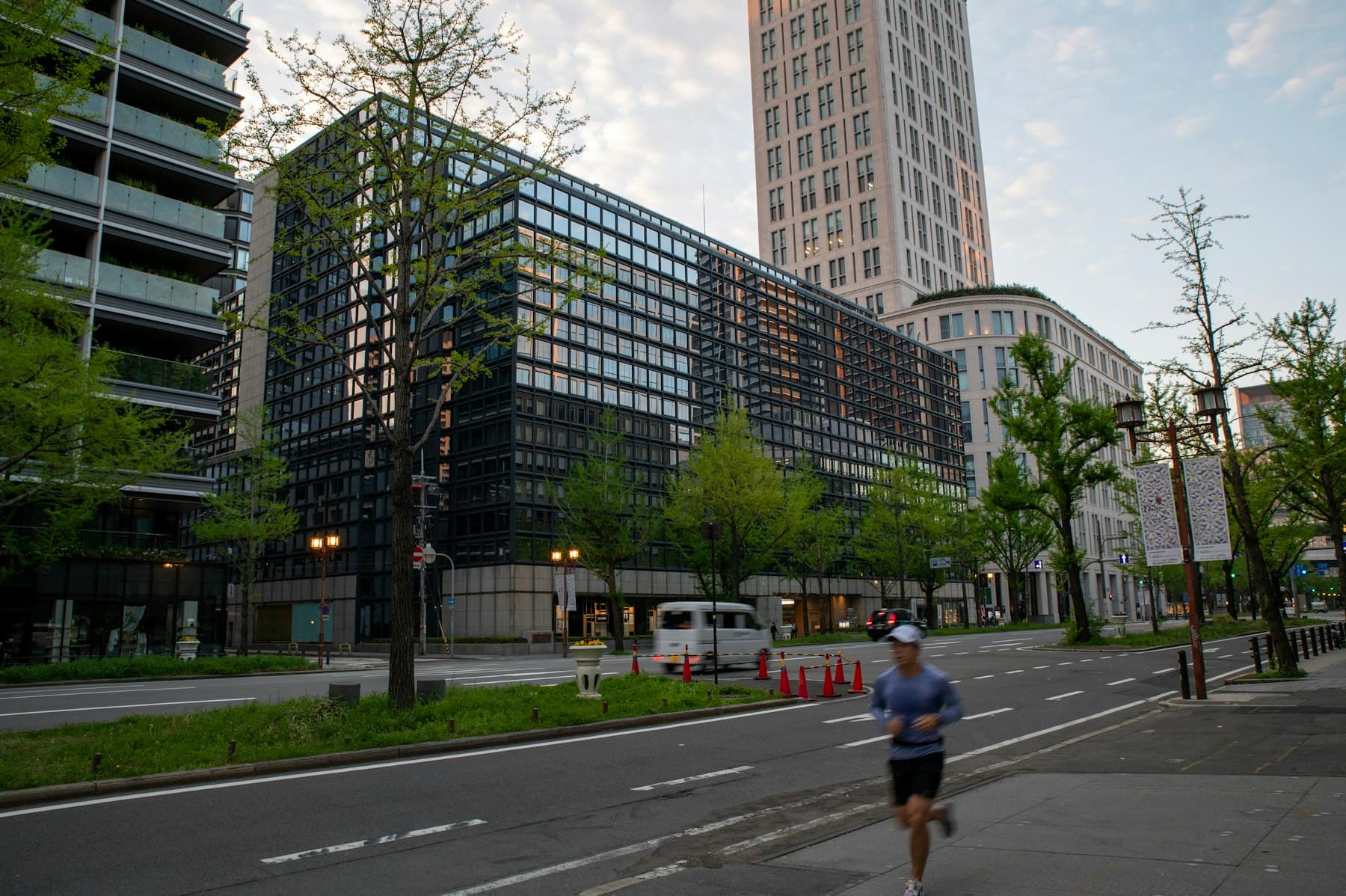 Runner beside modern city buildings for Healthy Aging Lab