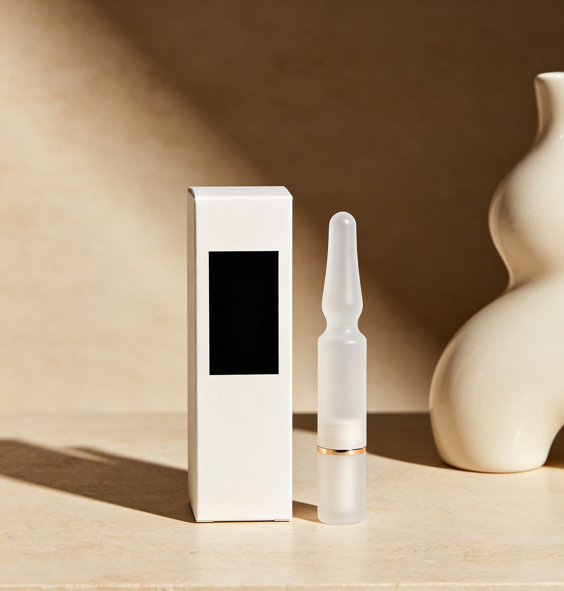Matte white ampoule and carton packaging concept